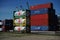 Cargo container and gaz tanks stacked on LeixÃµes harbor Matosinhos Portugal wait to be shipped by cargo ship