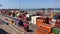 Cargo containers transport shipping at Italian industrial sea port of Livorno, Italy