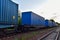 Cargo Containers Transportation On Freight Train By Railway. Intermodal Container On Train Car. Rail Freight Shipping Logistics