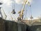 Cargo industrial port, port cranes. Loading of anthracite. Transportation of coal. Heap of coal