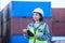 Cargo, logistics and shipping employee with tablet for digital checklist on container port for international transport