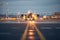 cargo plane taking off with runway lights in the foreground