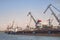 Cargo port , barges are for loading coal. Portal cranes , ship`s queue for loading.