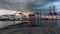 Cargo port of Halifax. Cranes loading ship. Sunset with cloudy sky. Halifax, Nova Scotia, Canada