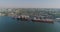 Cargo port with large ships and cranes. Sea port from the air.