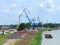 Cargo port, loading cranes, barge, bulk cargo