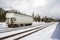 Cargo Railroad Car in a Train Station Covered in Snow