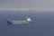 Cargo sea tanker stands on the pier, the city is visible