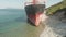 Cargo Ship aground at sea.