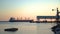 A cargo ship approaching the port on a calm day.