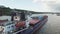 Cargo ship, a barge anchored in the river don.