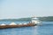 Cargo ship barge loaded with sand