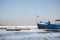 Cargo ship and a boat trapped on Frozen Danube during the 2017 winter, in Zemun, Belgrade, Serbia with ice popping out of water.