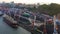 Cargo ship and a bulk carrier, standing at the quay wall, are loaded in the port