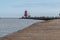 Cargo ship entering Dublin harbour at Poolbeg lighthouse.