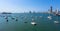 Cargo ship left port in Cartagena, Colombia. Beautiful yachts drift in the bay. Panorama The Bocagrande district in