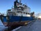 A cargo ship is mooring at the port.