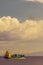 Cargo ship nearby Capo Peloro Lighthouse in Punta del Faro on the Strait of Messina, most north eastern promontory of Sicily,