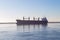 Cargo ship in the Parana river, anchored in front of the coast of Rosario.