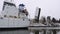 Cargo Ship Passing By in Canal and Open Footbridge at Winter