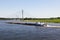 Cargo ship passing new Rhine bridge at Wesel