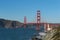 Cargo ship passing under the Golden Gate Bridge