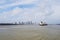 Cargo ship on a river and New Orleans city in background