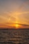 Cargo ship silhouette at Sunset in Oresund between Helsingor, Denmark and Helsingborg, Sweden