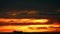 Cargo ship slow moving on sea and sunset red orange colud on sky