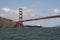 A cargo ship under Golden Gate Bridge