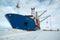 The cargo ship is unloaded onto the ice.