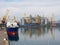 Cargo ship during unloading and loading in an industrial port, in the background loading cranes. Commercial port, Delivery