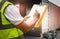 Cargo shipment loading for truck.Worker holding clipboard, his inspecting document with cargo.