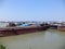 Cargo ships and boats dockyard or harbor and port on The Ganges river