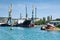 Cargo ships docked for loading in old harbor. The rusty buoy close-up.