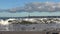 Cargo ships passing by on the baltic sea water at the world war monument in Laboe Germany