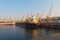 Cargo ships unloading at the port terminal