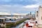 Cargo terminal for loading bulk cargo of cooper concentrates by shore cranes. View of piers and vessels under loading operation. V