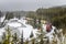 Cargo Train on a Curving Track on a Snowing Winter Day