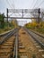 Cargo train riding on long railroad at cloudy morning