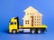 A cargo truck transports houses. Concept of transportation and cargo shipping, moving company. Construction of new houses