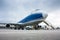 Cargo widebody airplane and aircraft passenger loader near terminal