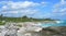 Caribbean beach background with lava rocks