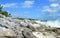 Caribbean beach background with lava rocks