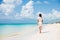 Caribbean beach luxury vacation summer holiday woman walking on perfect beach tourist destination