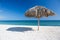 Caribbean beach with parasol in Cuba