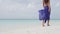 Caribbean beach travel - woman legs closeup walking on pristine white sand