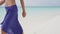 Caribbean beach travel - woman legs closeup walking on sand