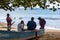 Caribbean fishermen sitting on a boat