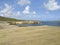 Caribbean landscape with vegetation, volcanic cliff and waves breaking over volcanic rocks.Savanna of Petrification. Martinique,